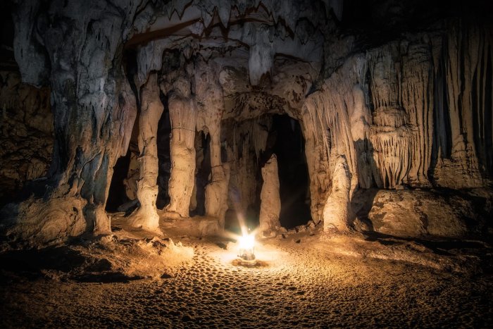 Exploring the Ancient Caves Near Watu Karung Beach